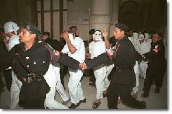 Queen Boat detainees being led to the courtroom, November 14, 2001. (Norbert Schiller)