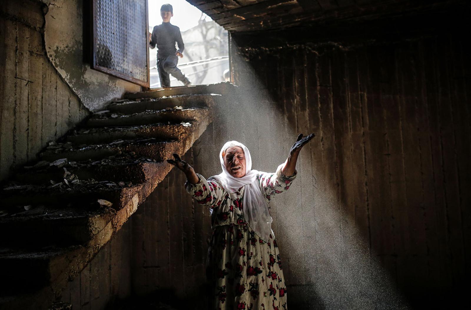 A woman in one of the basements after clashes